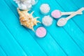 Sea Ã¢â¬â¹Ã¢â¬â¹salt in a glass white stones and Shell for spa and relaxation on a blue background Royalty Free Stock Photo